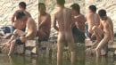 Chinese guy caught bathing naked and pissing in the river (Preview)