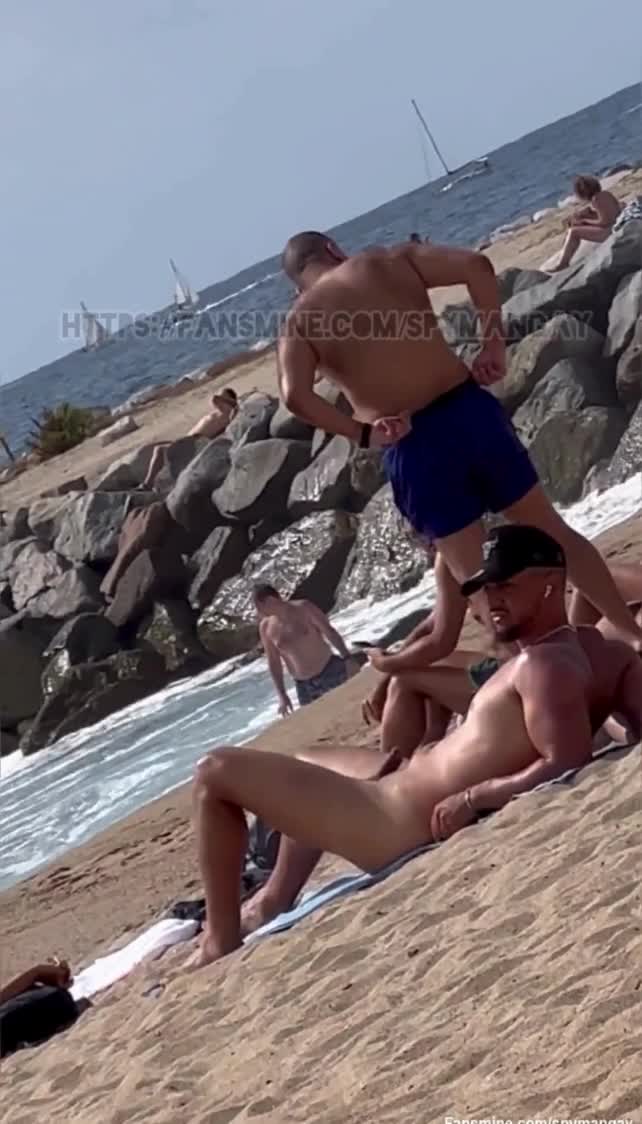 Young handsome guy taking sunbath in beach side