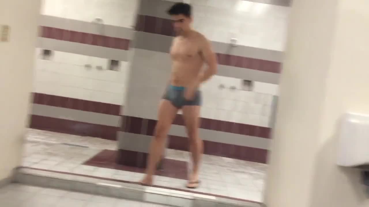 Sexy college guy with a big dick is followed to the showers! Watch him grabbing his bulge and find out what"s hidden when he takes off his undies!